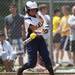 A Saline player makes contact with a ball in the game against Allen Park on Saturday, June 8. Daniel Brenner I AnnArbor.com